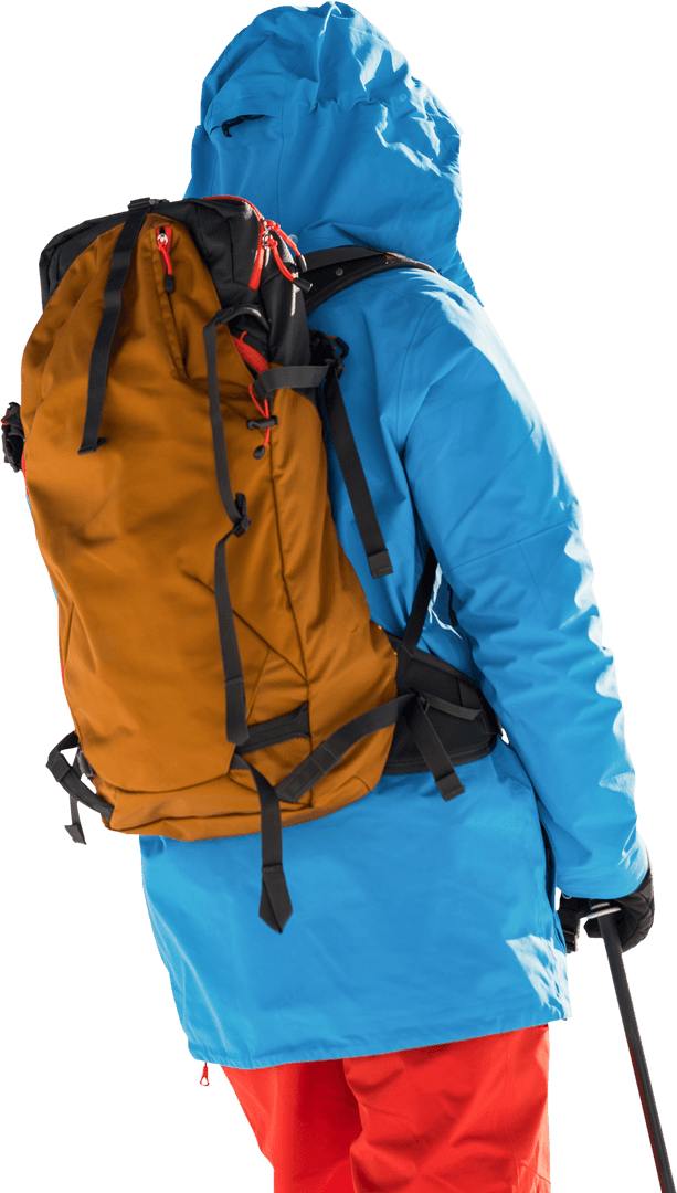 Skier Wearing Blue Jacket with Yellow Backpack on Transparent Background