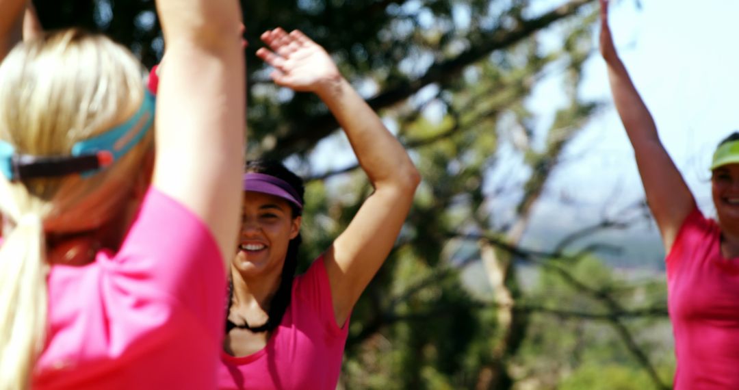 Group of Women Exercising Outdoors in Bright Pink Shirts - Free Images, Stock Photos and Pictures on Pikwizard.com