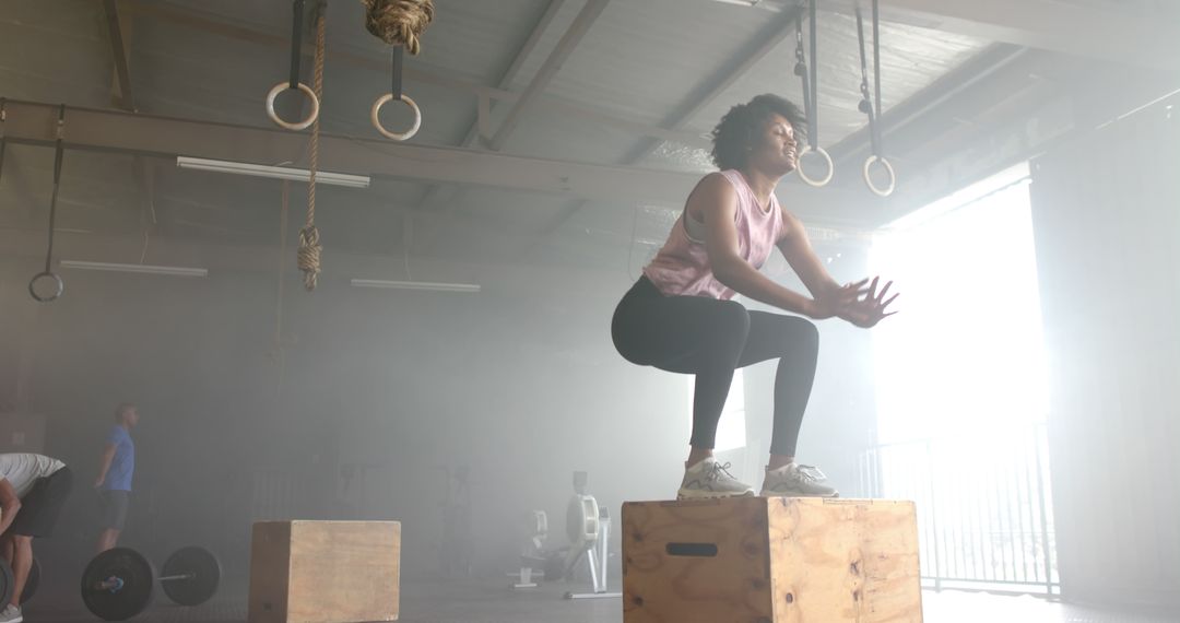 Woman Performing Box Jumps in CrossFit Gym - Free Images, Stock Photos and Pictures on Pikwizard.com