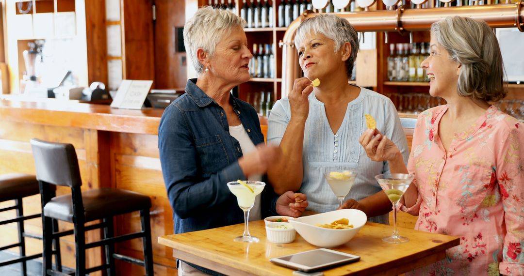 Three Senior Women Enjoying Drinks and Snacks in Café - Free Images, Stock Photos and Pictures on Pikwizard.com