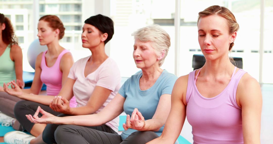 Group of Women Practicing Yoga Together Indoors - Free Images, Stock Photos and Pictures on Pikwizard.com