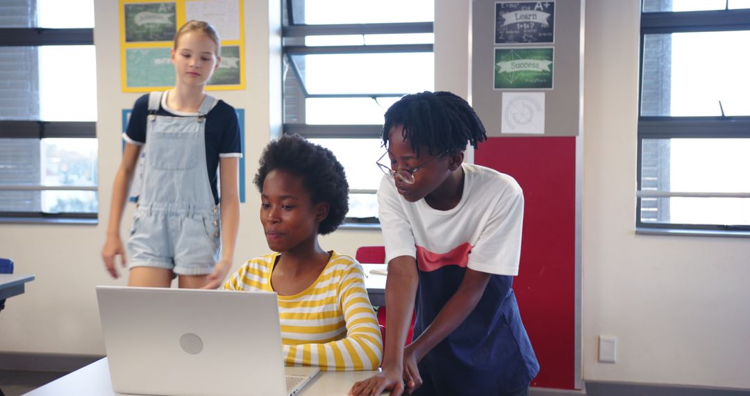 Diverse Students Collaborating on a Classroom Laptop Project