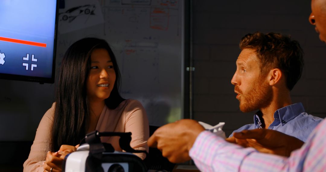 Team discussing VR project in office - Free Images, Stock Photos and Pictures on Pikwizard.com