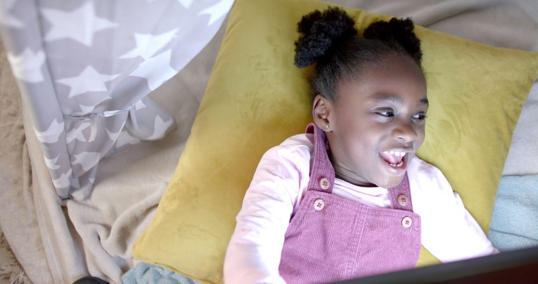 Joyful African American Girl Using Tablet at Home in Blanket Tent - Free Images, Stock Photos and Pictures on Pikwizard.com