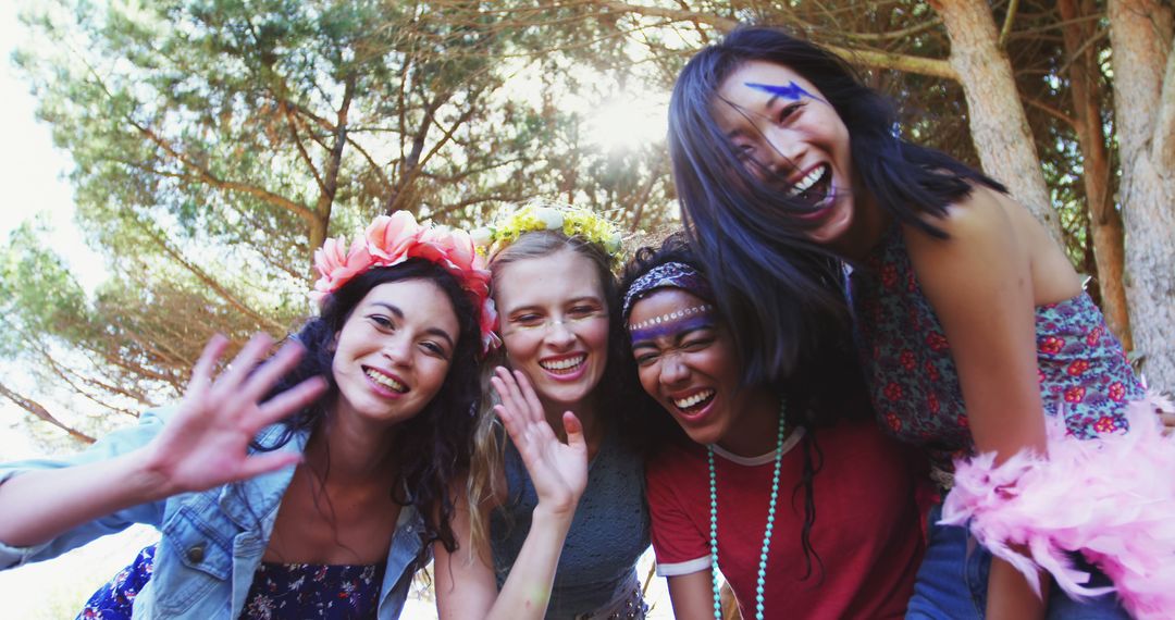 Young Women Laughing and Embracing in Outdoor Park - Free Images, Stock Photos and Pictures on Pikwizard.com