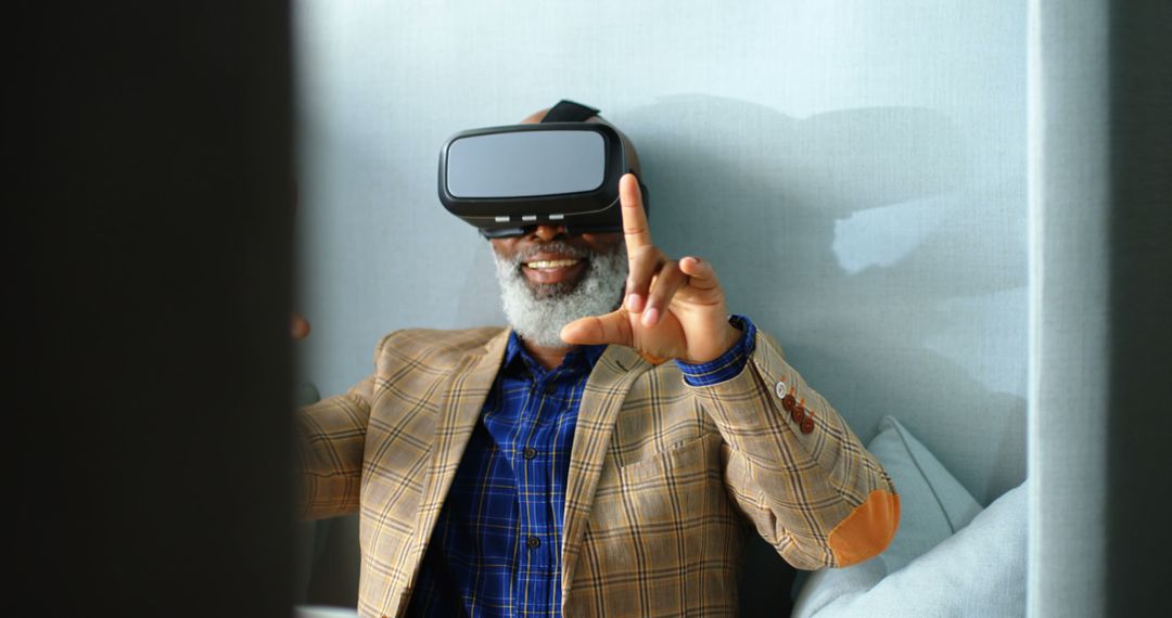 Elderly Man Joyfully Experiencing Virtual Reality - Free Images, Stock Photos and Pictures on Pikwizard.com