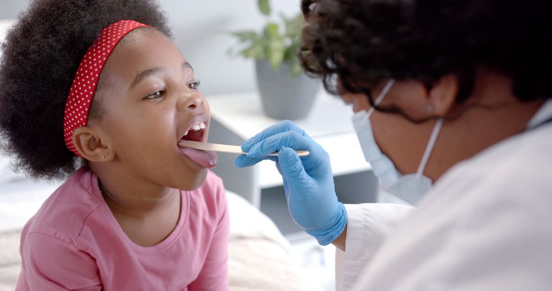 Doctor Examining Young Girl with Face Mask and Gloves - Free Images, Stock Photos and Pictures on Pikwizard.com