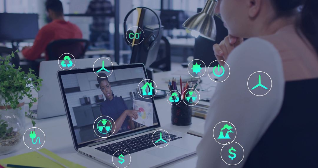Woman Video Conferencing with Digital Energy Icons at Office Desk