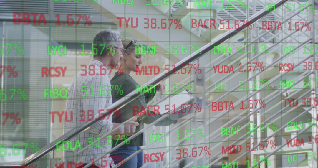 Business Professionals Analyzing Digital Financial Data Display