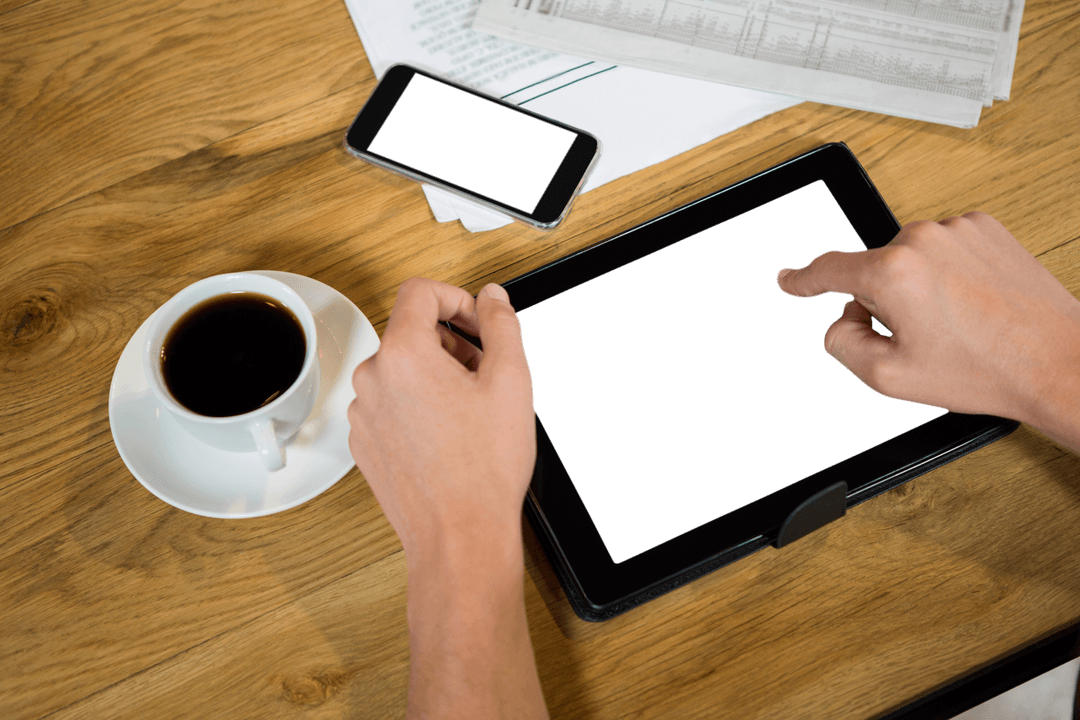 Transparent Tablet Display in Coffee Shop with Coffee and Smartphone