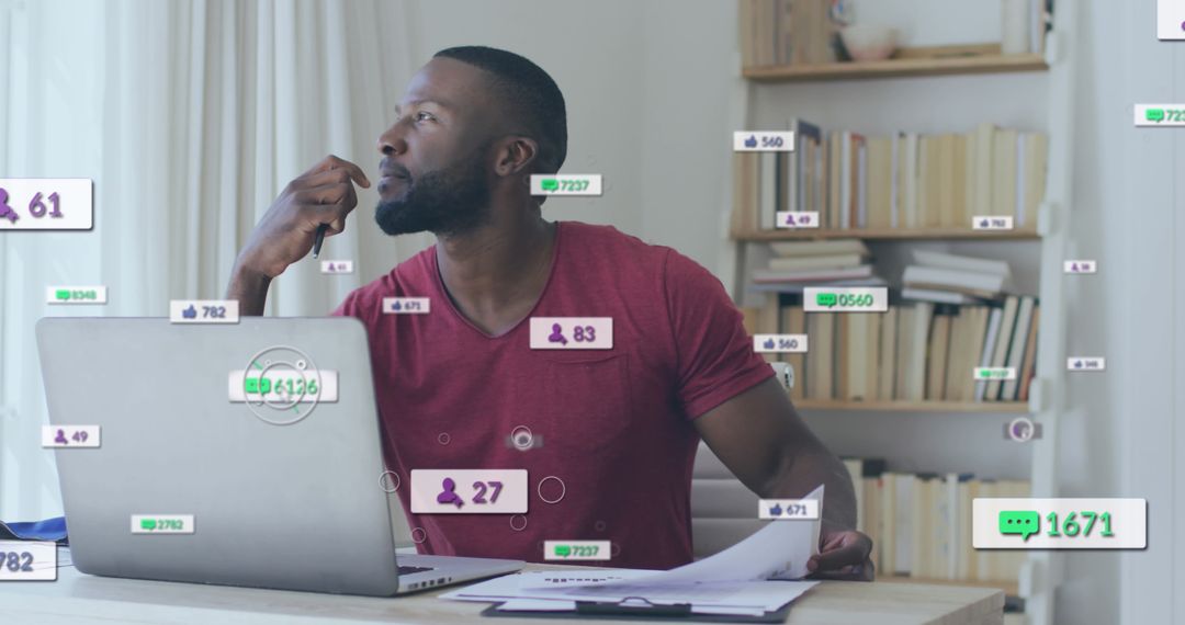 Focused Man Analyzing Social Media Data on Laptop