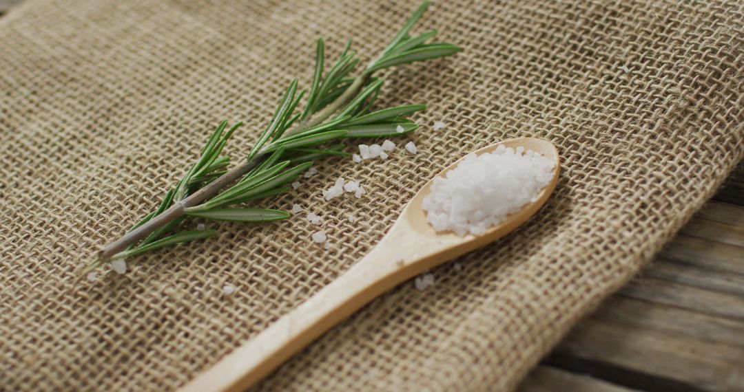 Fresh Rosemary and Salt on Rustic Burlap Surface