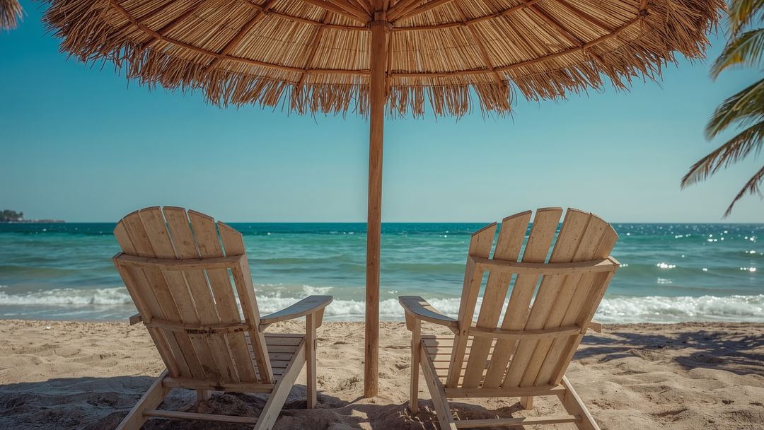 Beachfront Tranquility with Relaxing Lounge Chairs and Umbrella