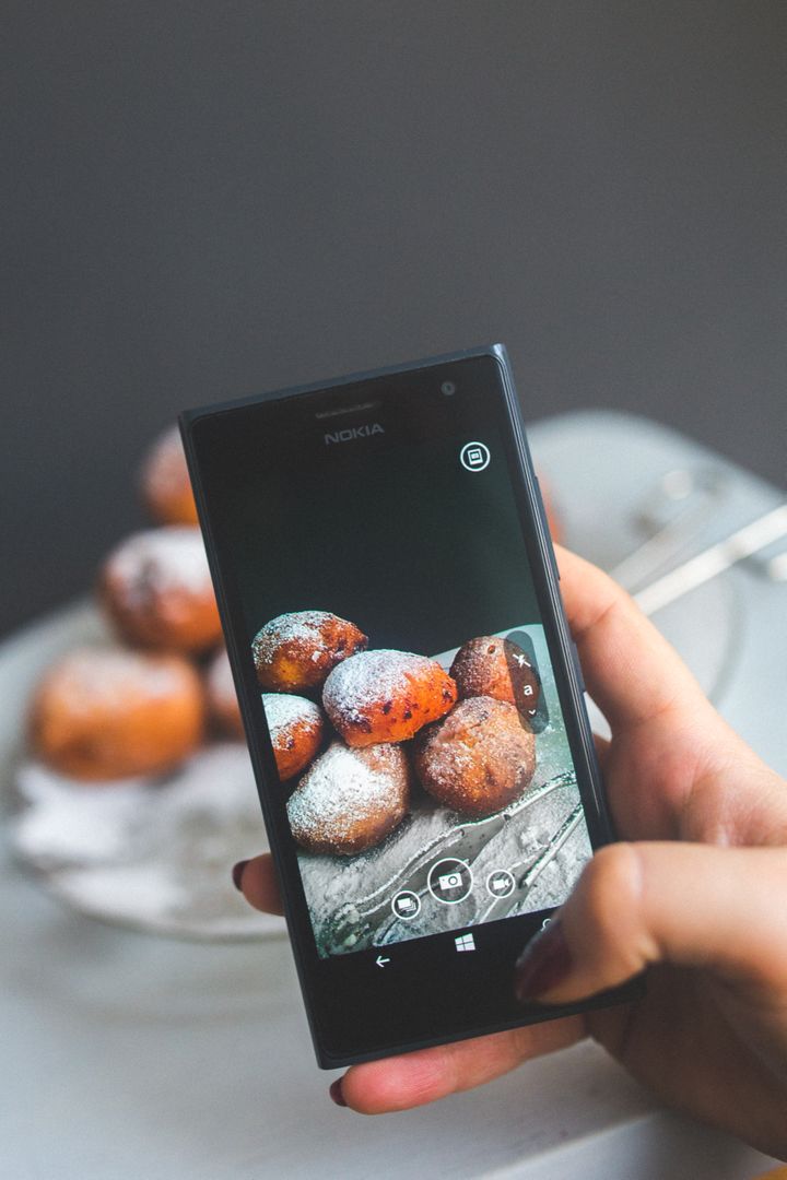 Person Photographing Homemade Doughnuts Using Smartphone - Free Images, Stock Photos and Pictures on Pikwizard.com