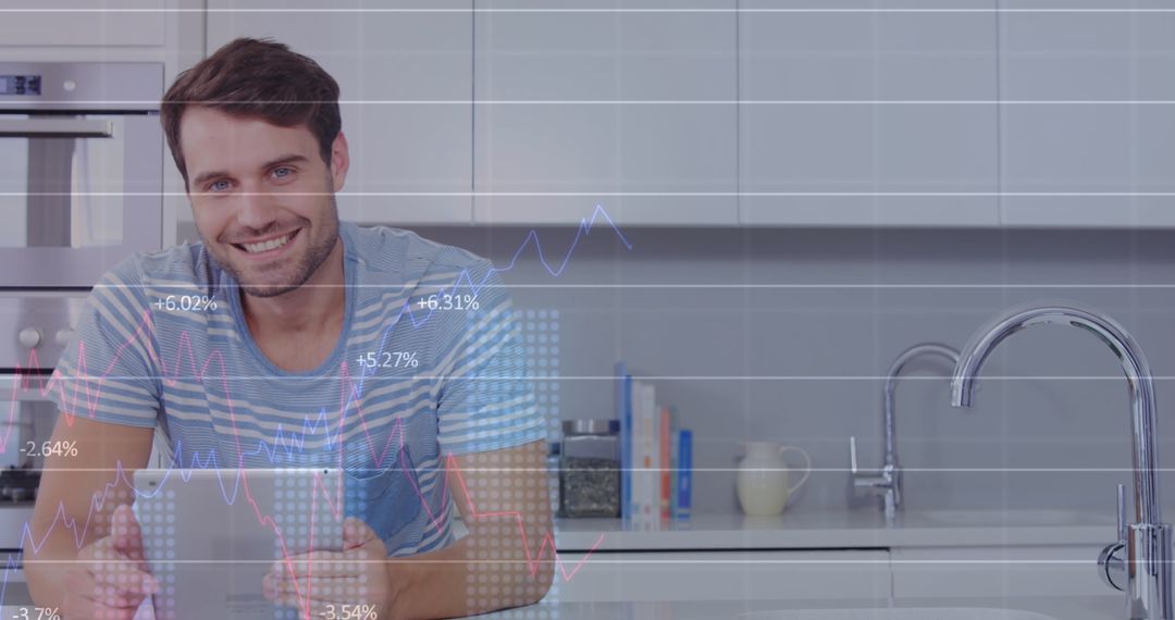 Smiling Businessman Analyzing Data on Tablet in Modern Kitchen