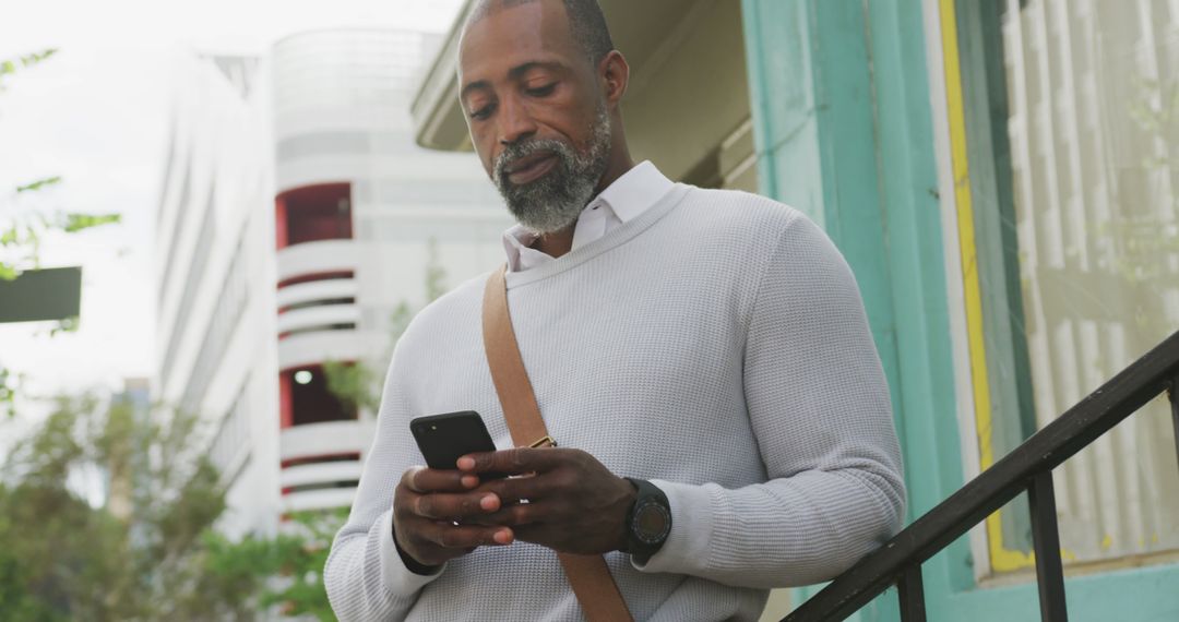 Mature Man Using Smartphone Outdoors for Online Interaction - Free Images, Stock Photos and Pictures on Pikwizard.com