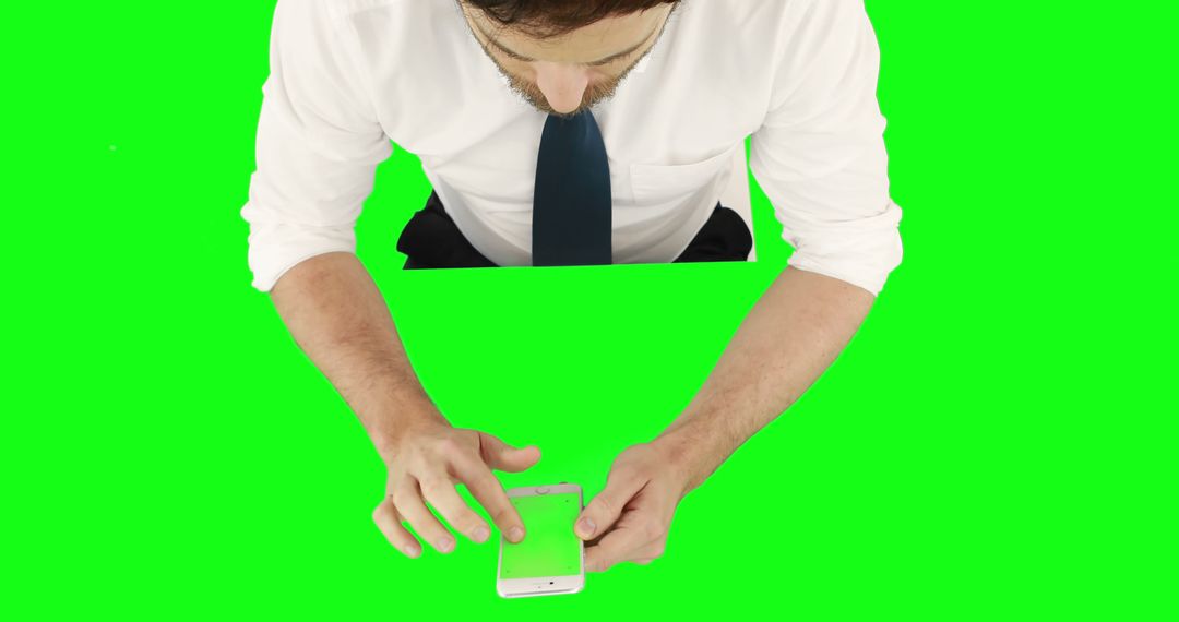 Businessman Using Smartphone over Green Screen Background - Free Images, Stock Photos and Pictures on Pikwizard.com