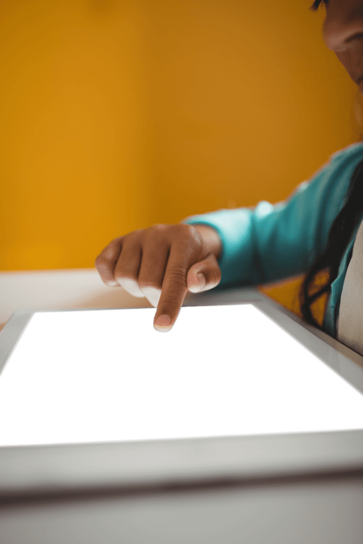 Girl Interacting with Transparent Digital Tablet Screen