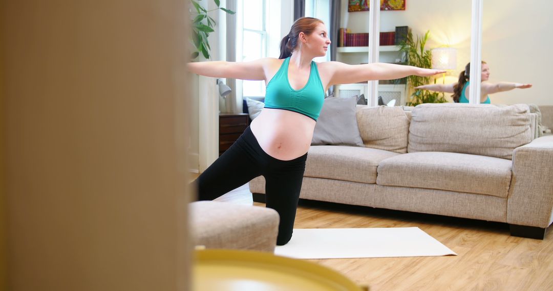 Pregnant woman practicing yoga in living room during daytime - Free Images, Stock Photos and Pictures on Pikwizard.com