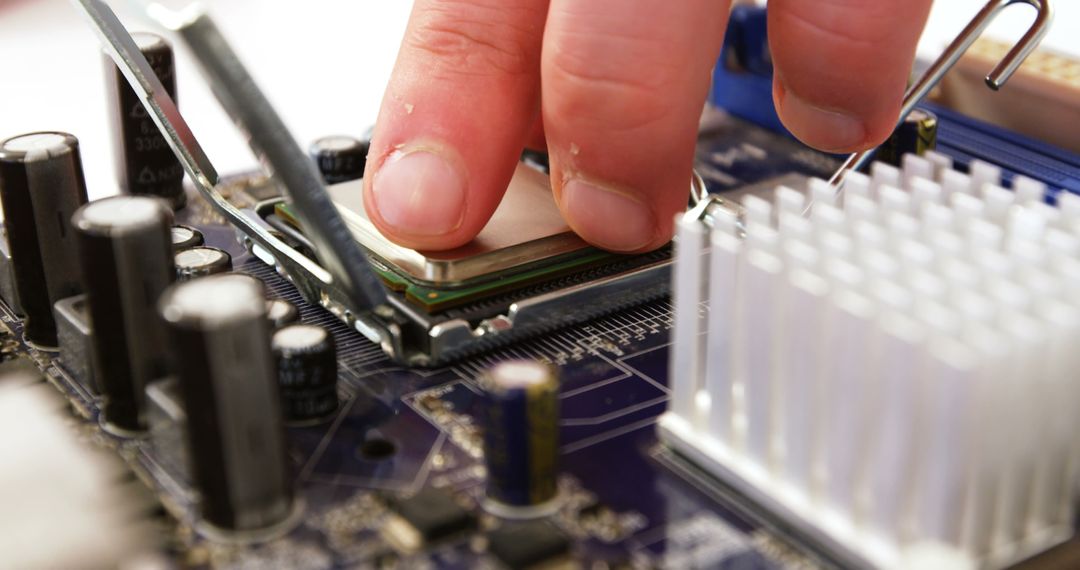 Technician Repairing Computer Motherboard with Precise Tools