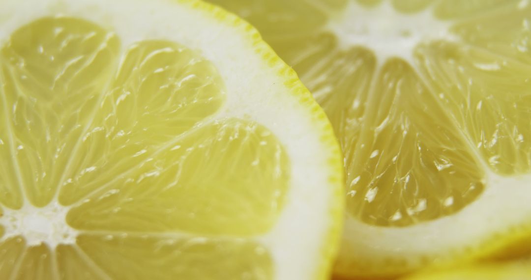 Close-Up of Fresh Lemon Slices with Vibrant Yellow Color - Free Images, Stock Photos and Pictures on Pikwizard.com