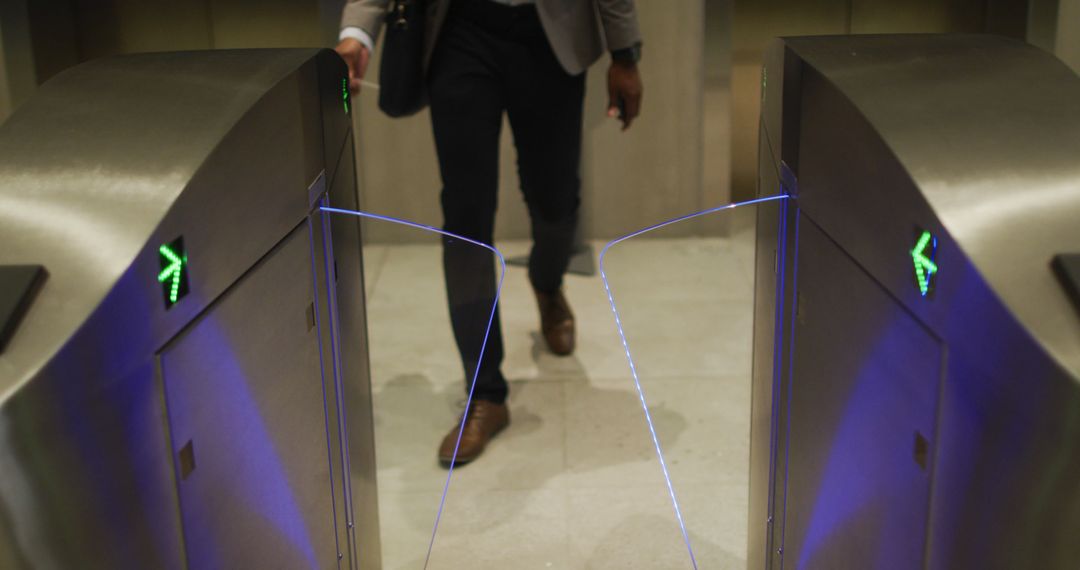 Businessman in Office Attire Walking Through Automated Security Gates - Free Images, Stock Photos and Pictures on Pikwizard.com