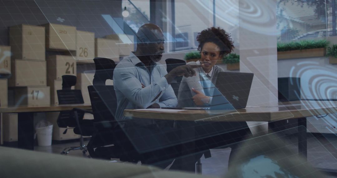 Colleagues Analyzing Data Visualization in Modern Workspace