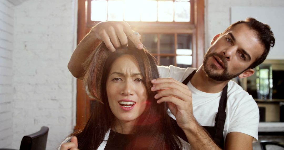 Hairdresser Showing Client Split Ends for Consultation - Free Images, Stock Photos and Pictures on Pikwizard.com