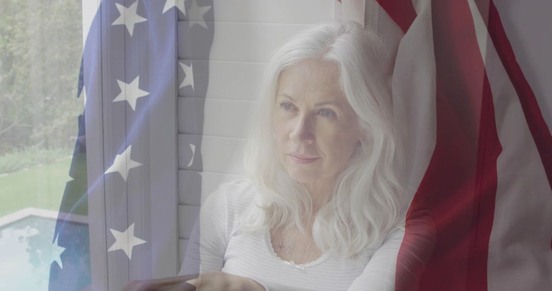 Contemplative Senior Woman Reflective Seated by Shuttered Window