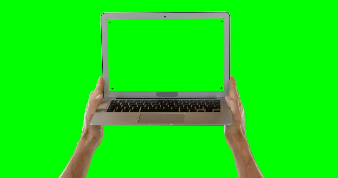 Hands Holding Laptop with Green Screen for Custom Content Creation - Free Images, Stock Photos and Pictures on Pikwizard.com