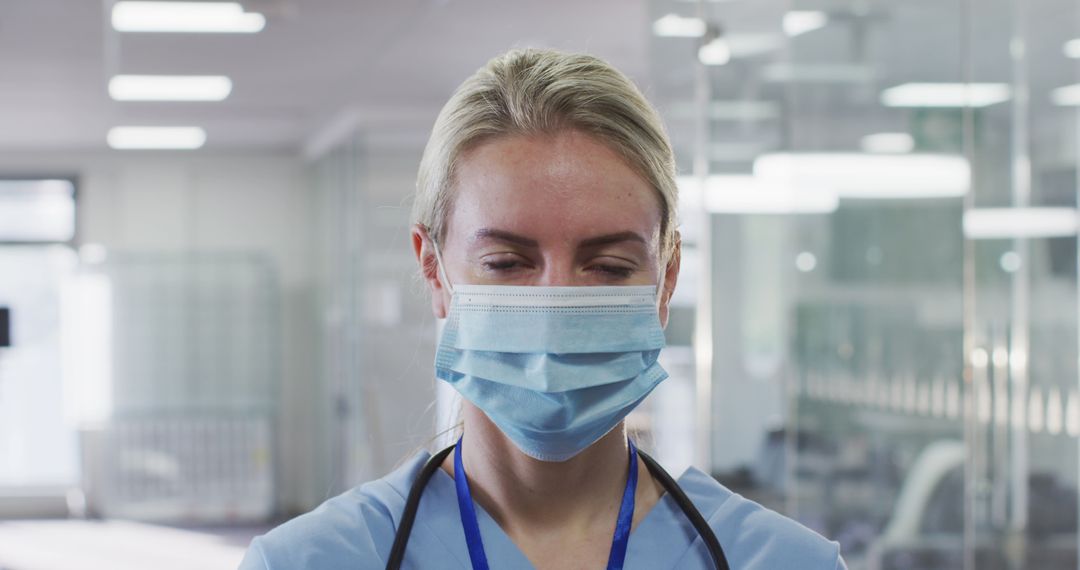 Female Healthcare Worker Wearing Mask in Hospital - Free Images, Stock Photos and Pictures on Pikwizard.com