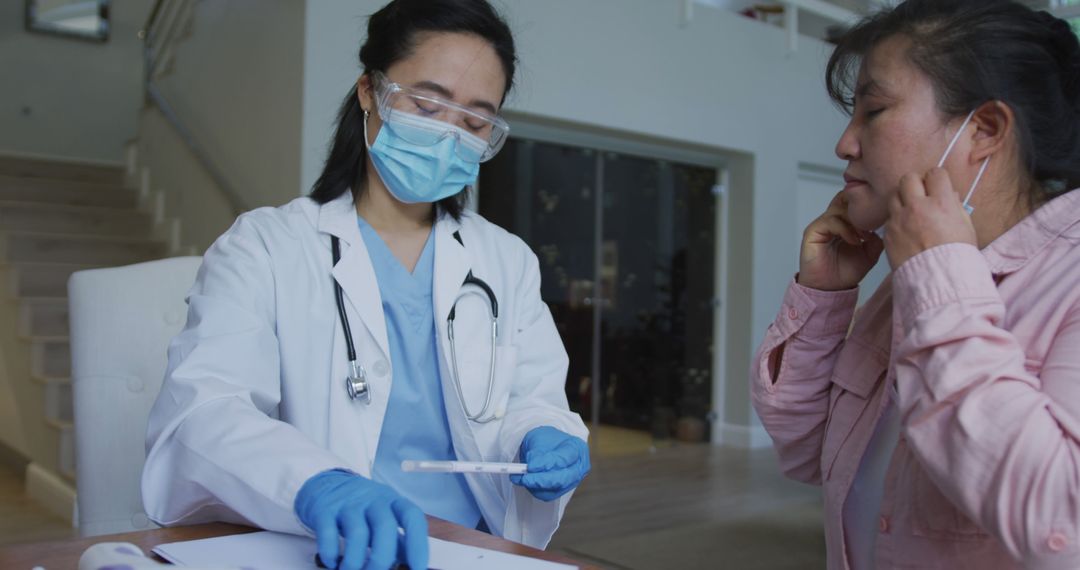 Female Doctor Consulting Patient While Holding a Syringe - Free Images, Stock Photos and Pictures on Pikwizard.com