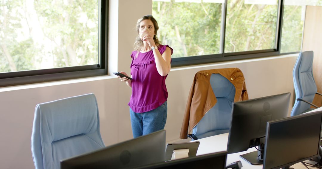 Professional Woman Thinking and Taking a Break in a Modern Office - Free Images, Stock Photos and Pictures on Pikwizard.com