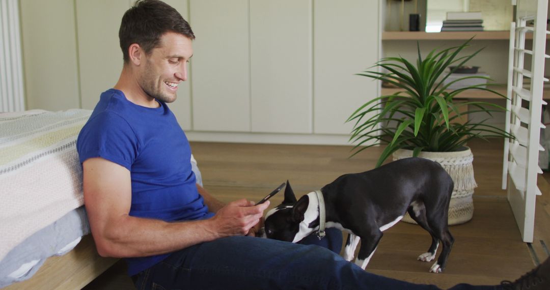 Man Enjoying Playful Moment with His Dog at Home