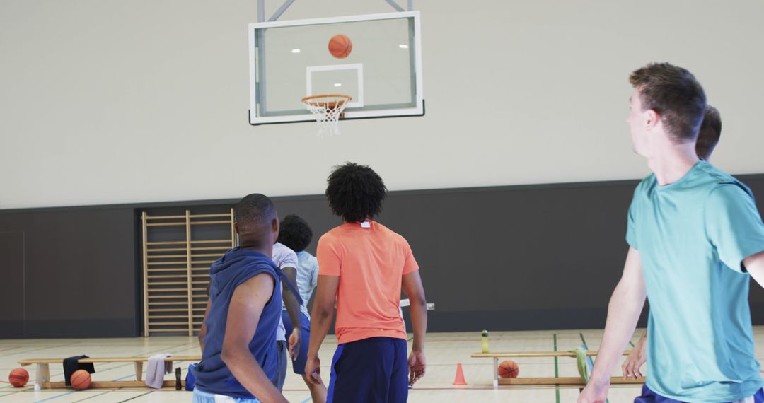 Diverse Basketball Team Practicing Drills Indoors