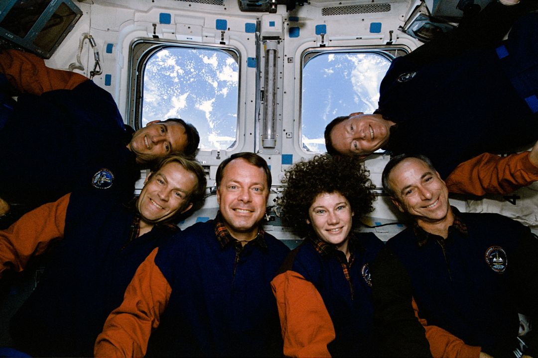 Astronauts Posing Inside Shuttle in Microgravity Above Earth 1994