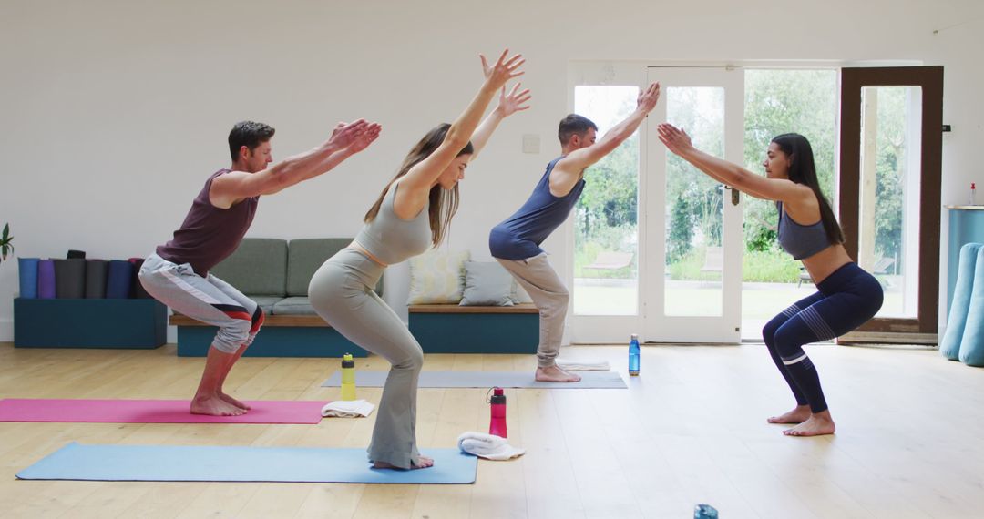 Group Yoga Class with Female Instructor in Spacious Studio