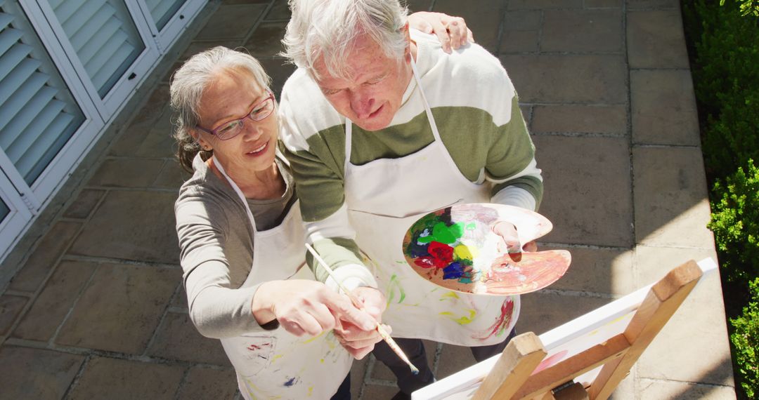 Elderly Couple Enjoying Art Together Outdoors - Free Images, Stock Photos and Pictures on Pikwizard.com