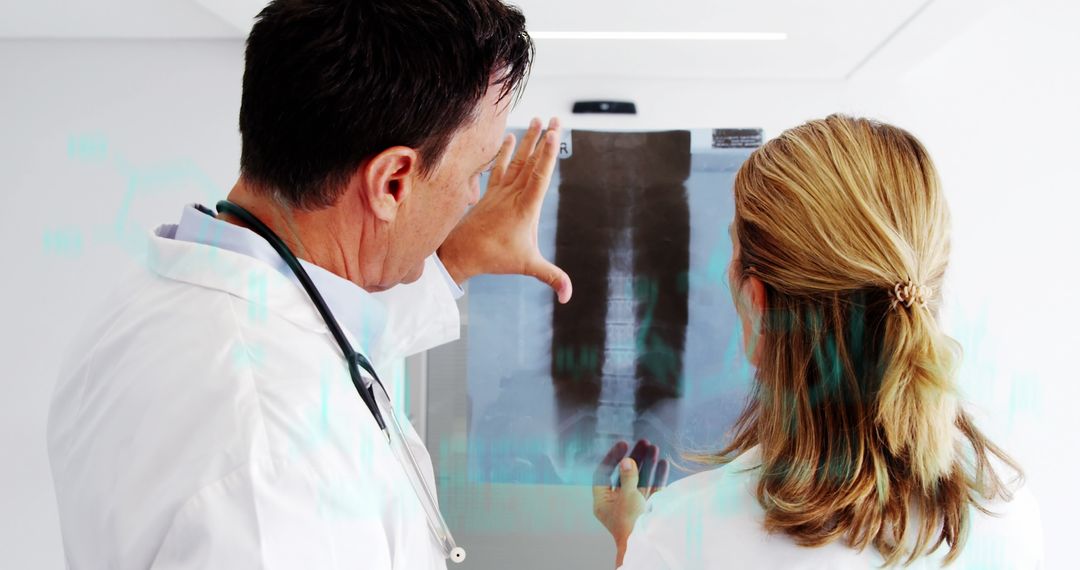 Doctors Analyzing X-ray in Medical Technology Environment