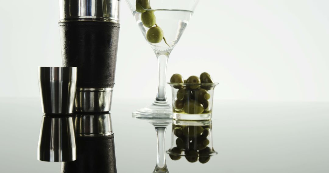 Elegant Martini with Olives and Cocktail Shaker
