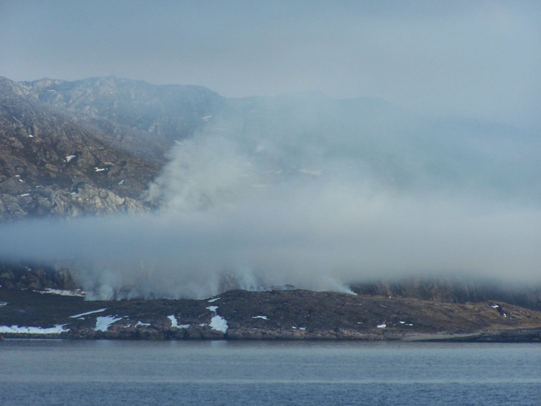 Calm Misty Mountain with Smoke Over Water at Dawn - Free Images, Stock Photos and Pictures on Pikwizard.com