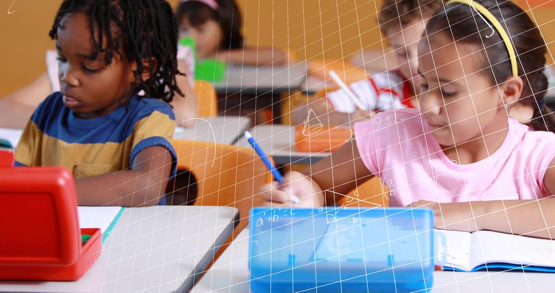 Elementary students working with tablets and writing in notebooks practicing math