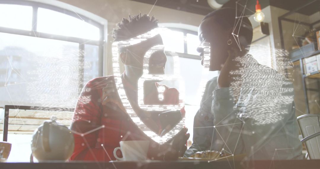 Pair discussing cybersecurity in cafe with padlock, fingerprint and network overlay