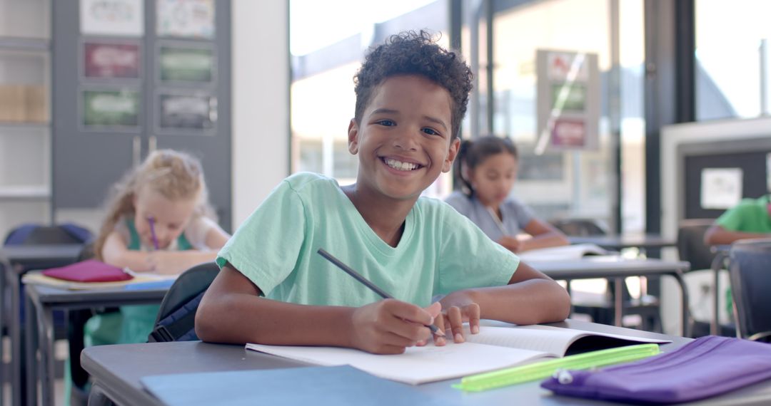 Smiling Boy Learning in Classroom Setting