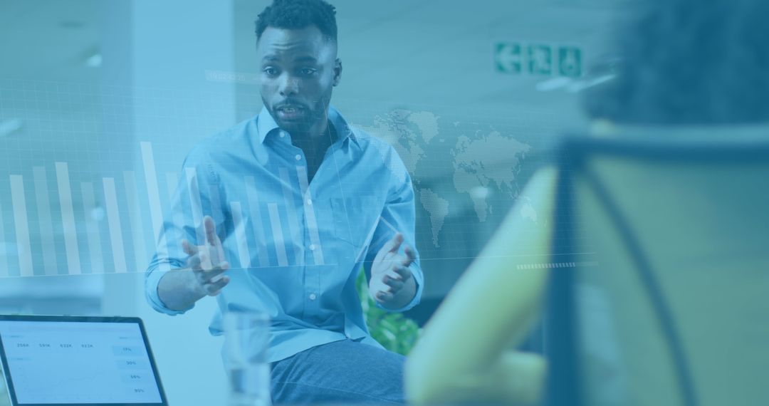 Businessman Discussing Data Analytics with Colleague in Office