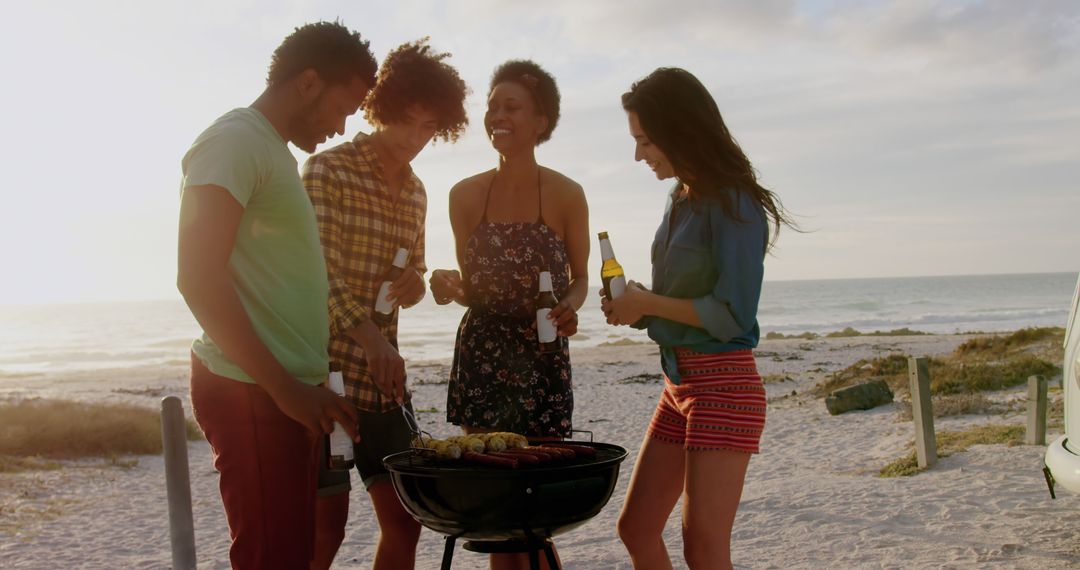 Friends Enjoying Beach Barbecue with Drinks at Sunset - Free Images, Stock Photos and Pictures on Pikwizard.com