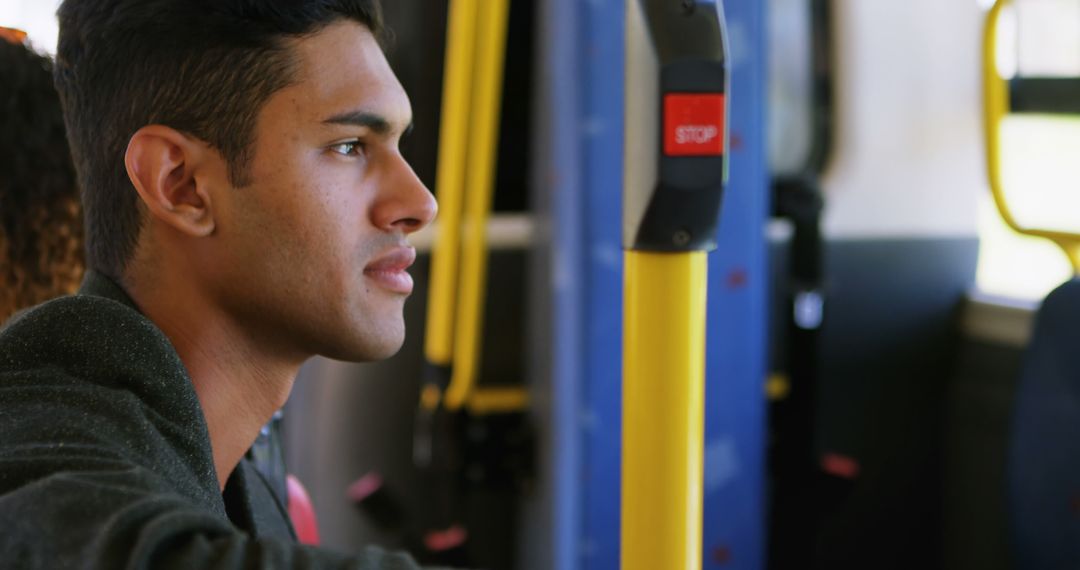 Young Man Reflecting on a Bus During Daily Commute - Free Images, Stock Photos and Pictures on Pikwizard.com