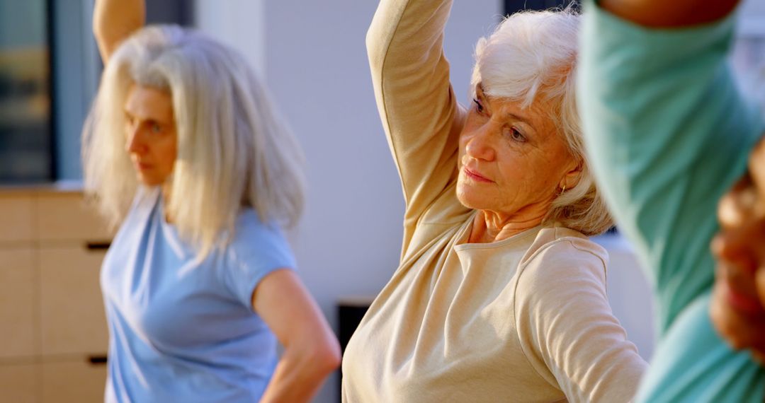 Senior women exercising in fitness class, promoting healthy lifestyle - Free Images, Stock Photos and Pictures on Pikwizard.com