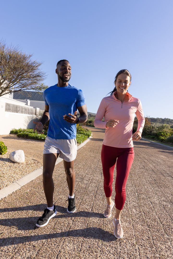 Diverse Friends Jogging On Sunny Day