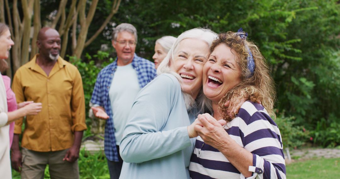 Group of Elderly Friends Laughing and Dancing Outdoors - Free Images, Stock Photos and Pictures on Pikwizard.com